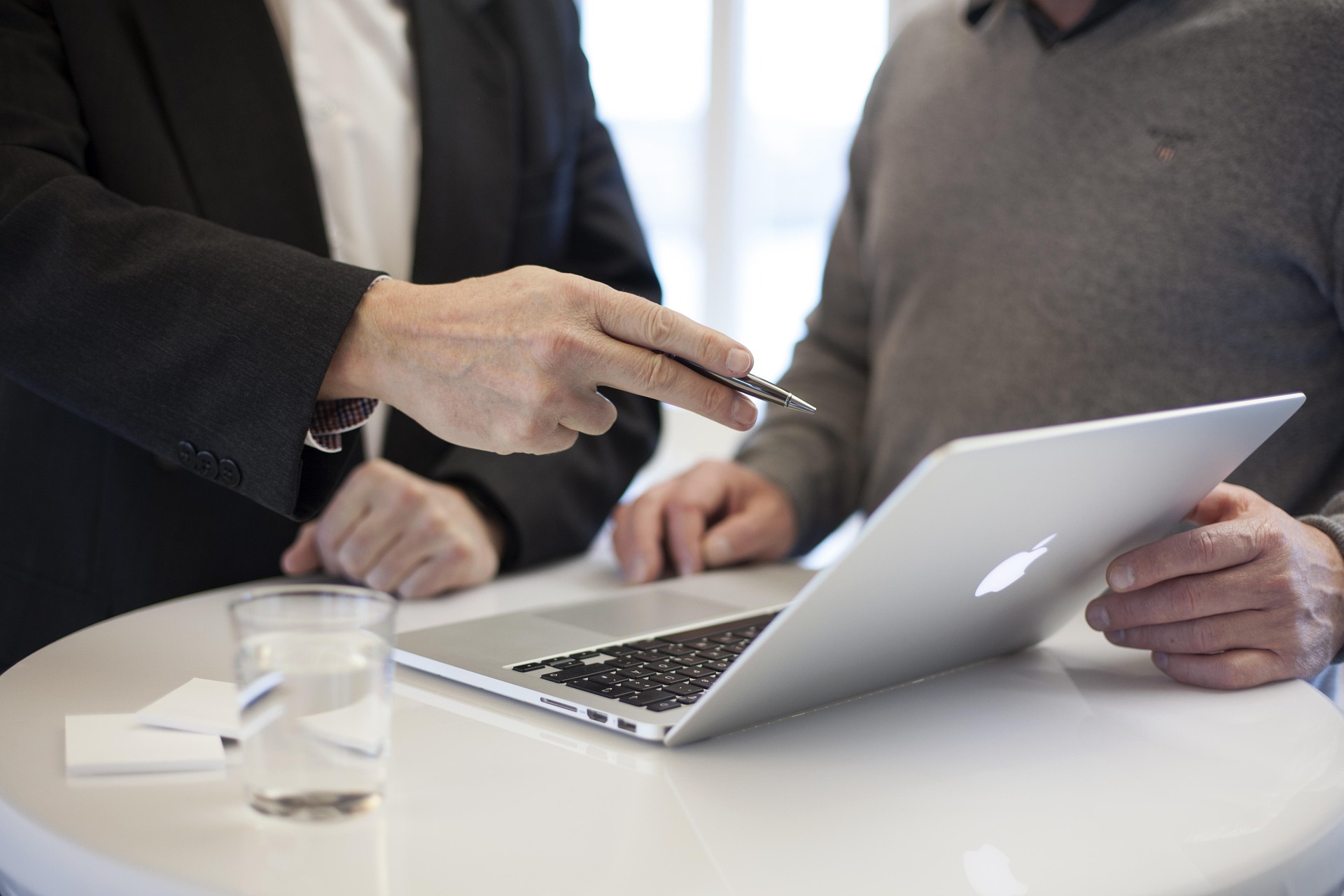 Mortgage broker meeting with clients at a table